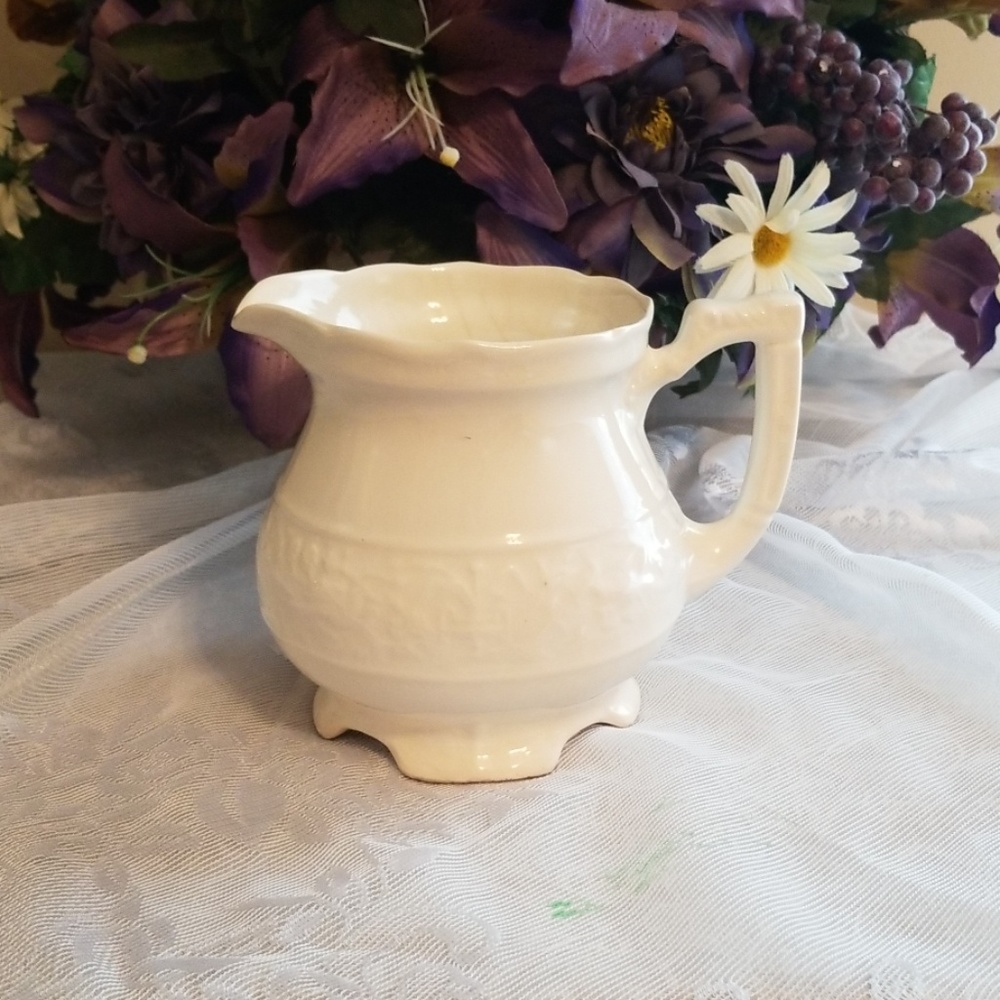 Small white pitcher
